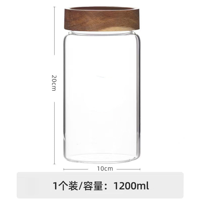 Whole freeze-dried dark red rose crown tea blossom unfurling inside an architectural borosilicate glass ritual jar